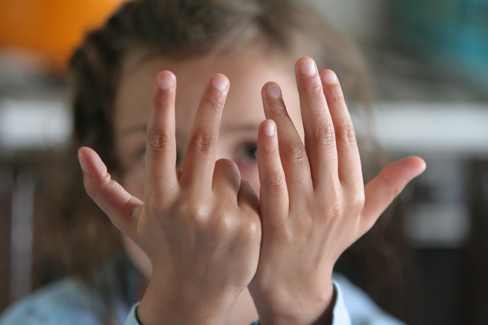 Girl Counting on Fingers